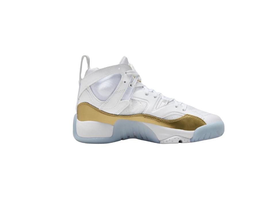 image of right foot of Jumpman Two Trey women's shoes w/ gold detail on white background