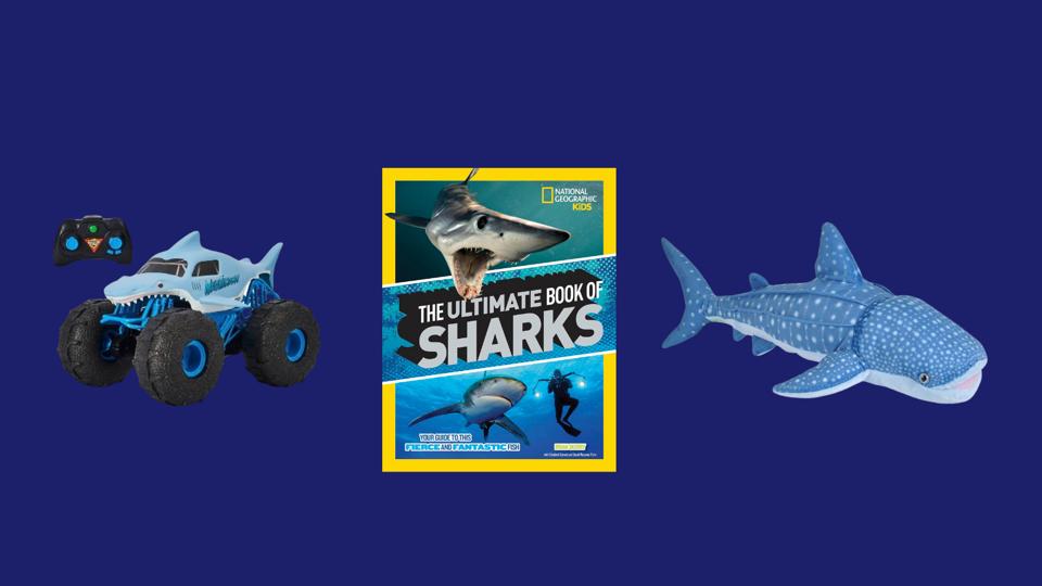 Three shark-themed items for kids: a toy race car, a shark book and a whale shark stuffed animal.