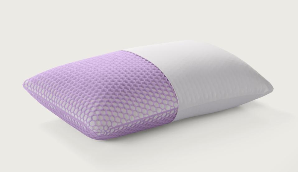 The Purple Harmony Pillow with have of the interior showing against a white background