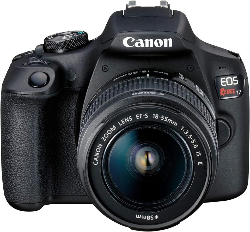 The Canon EOS Rebel T7 camera with a lens on a white background