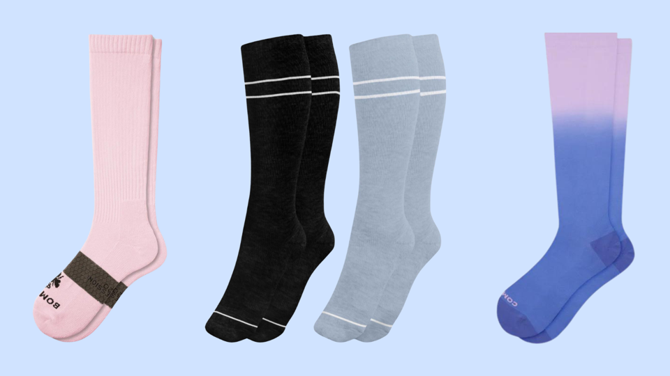 4 pairs on pregnancy compression socks on a light blue background