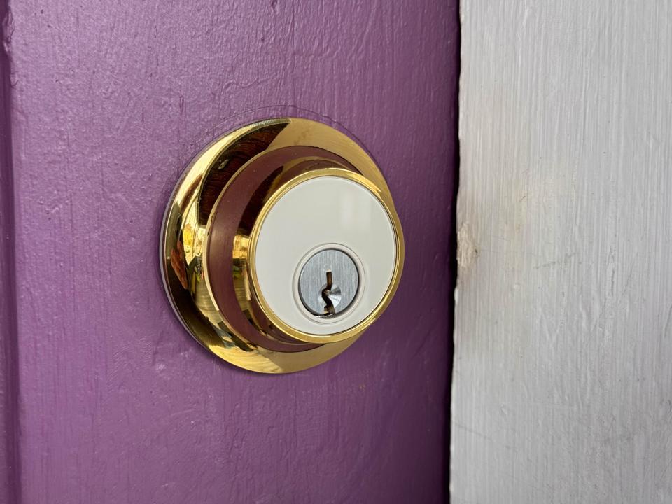 The Level Lock+ Connect on a purple door.