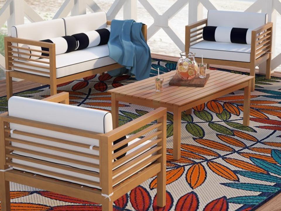 Lifestyle shot of the Wade Logan Arlethe Outdoor Seating Group (4 Person) in natural.