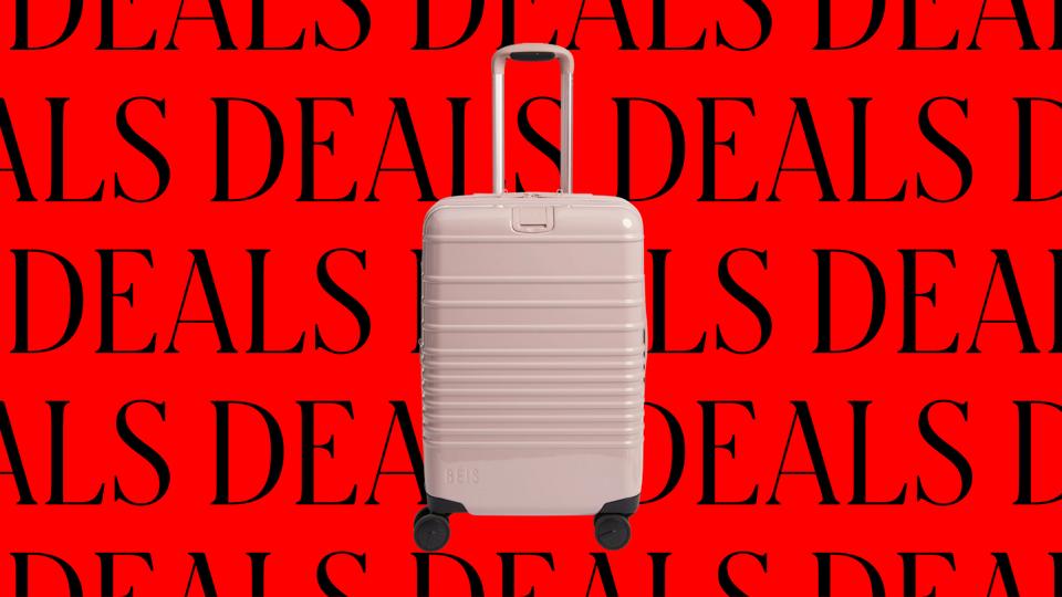 Pink Beis Carry-On suitcase on a red and black background with the word "deals" repeated 