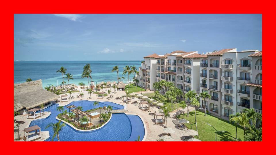 A photo of the Fiesta Americana Cancun Villas surrounded by a red border