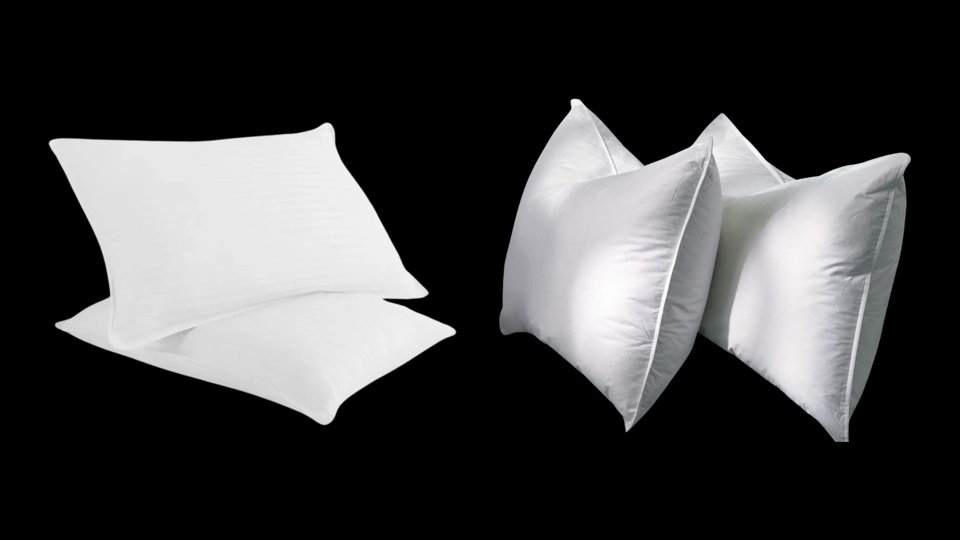 Two sets of two white hotel pillows on a black background