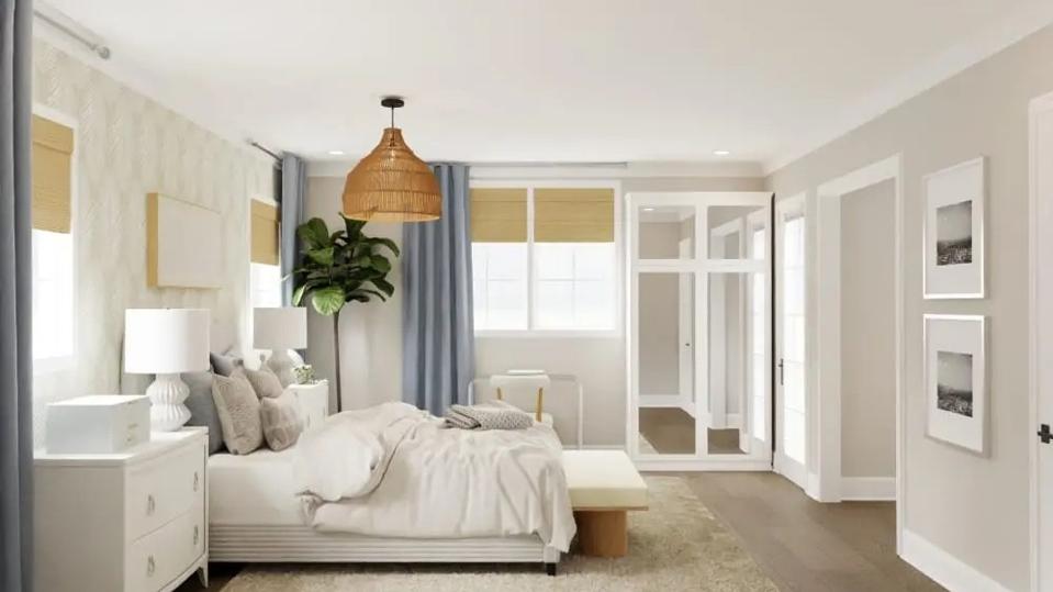 A coastal bedroom with a bed and plenty of gray or taupe pillows and blue window shades.