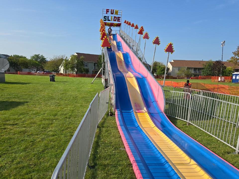 A multi-colored fun slight at a fair.