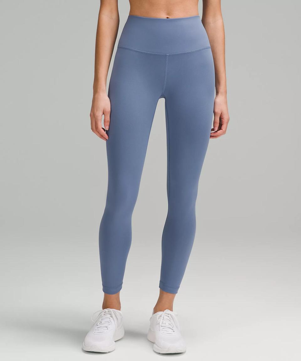 Woman wearing Lululemon Wunder Train High-Rise Tight in Oasis Blue.