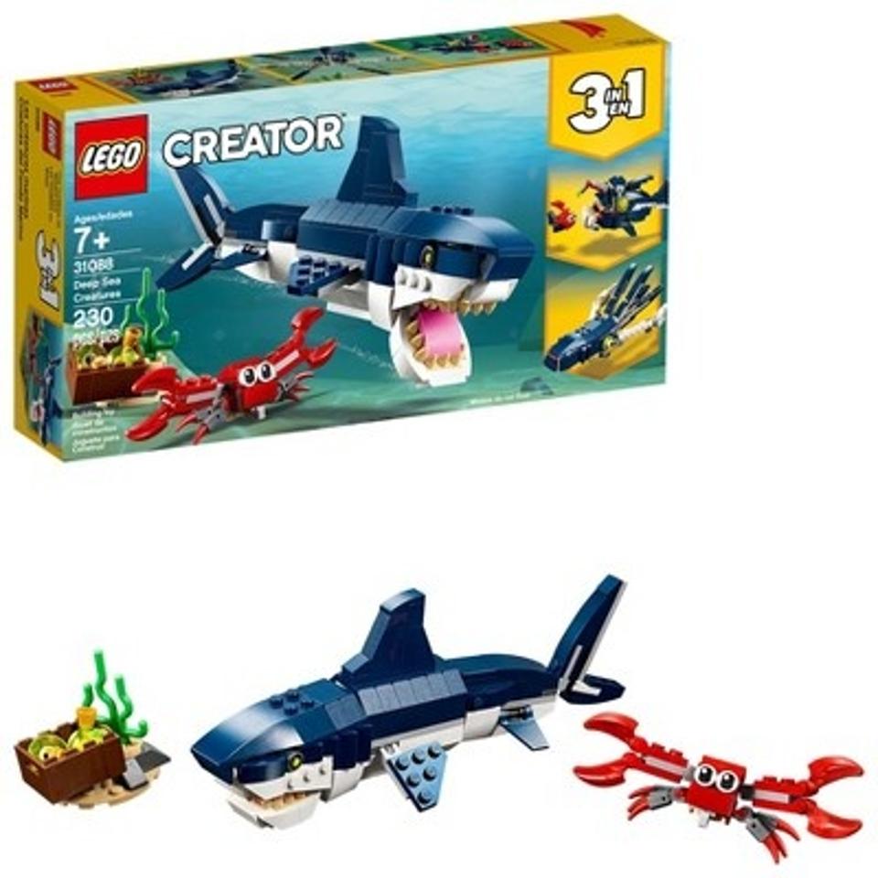 A LEGO box showing a large shark and a crab, along with accessories.