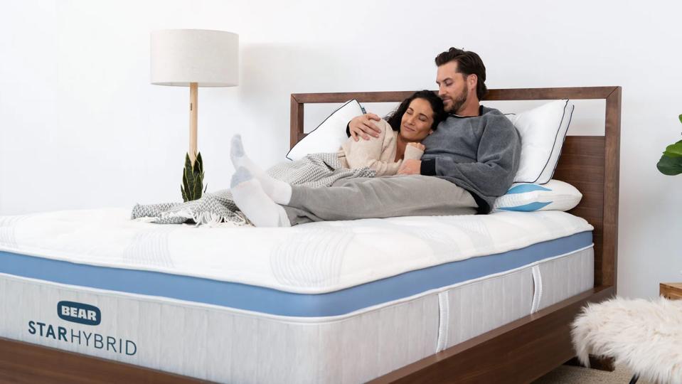 A couple on the Bear Star Hybrid Mattress.