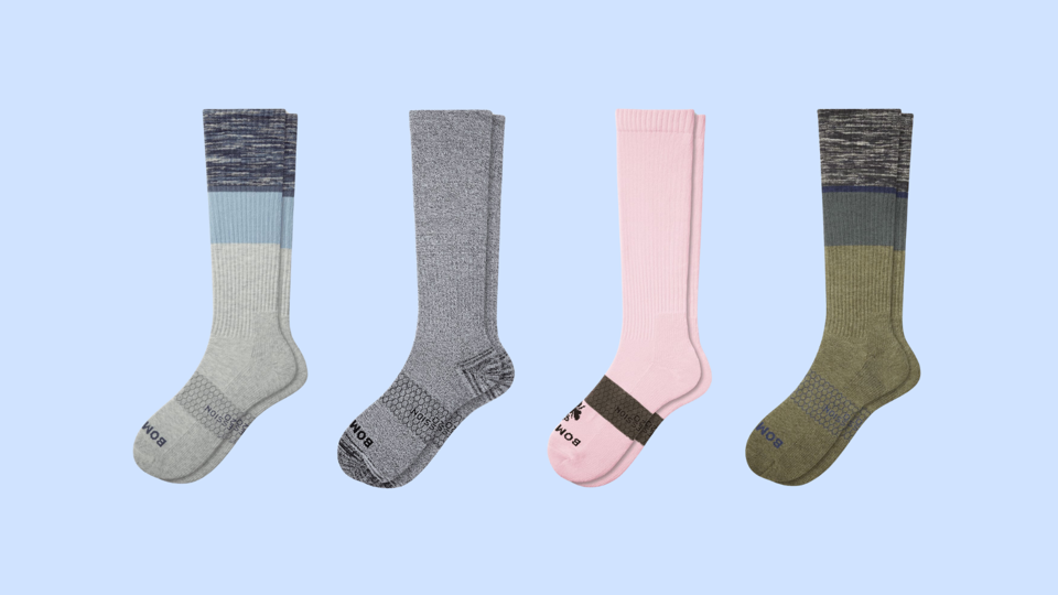 The Bombas Everyday Compression Socks on a light blue background