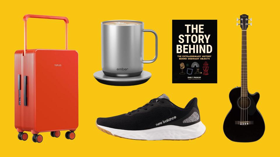 Ember smart mug, New Balance Sneakers, Fender guitar, orange suitcase on yellow background