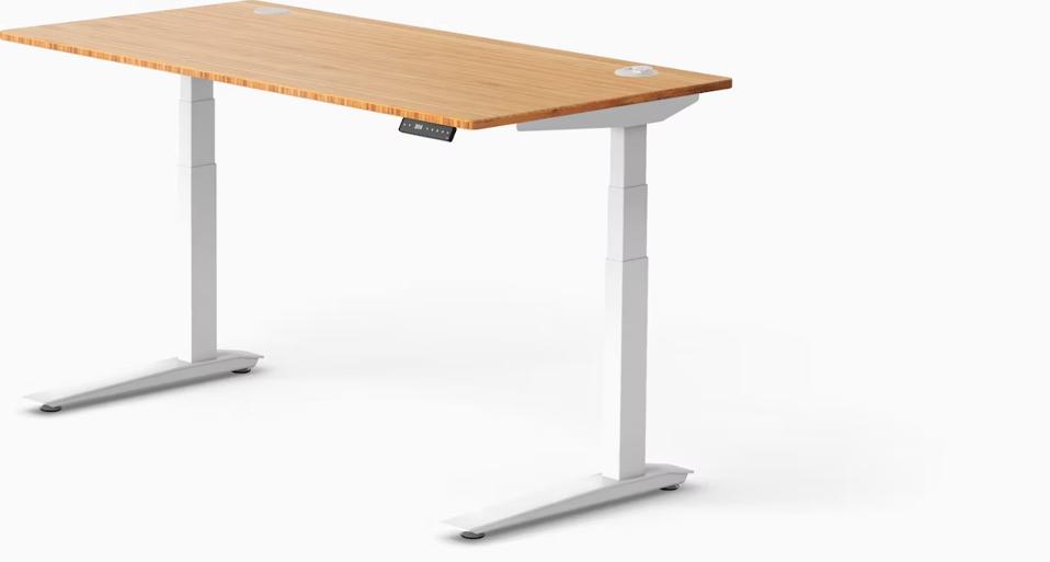 Jarvis Bamboo Standing Desk with white legs and light wood top