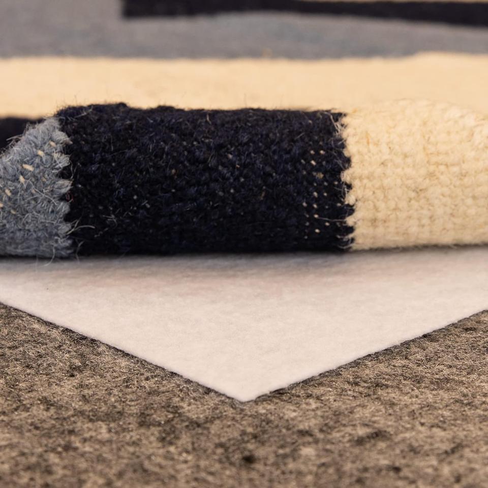 Slip-Stop Magic Stop Rug On Carpet Non-Slip Rug Pad in between two rugs. 