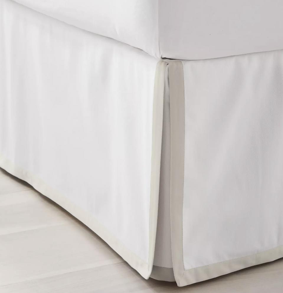 Serena & Lily Border Frame Bed Skirt shown on the corner of a bedframe