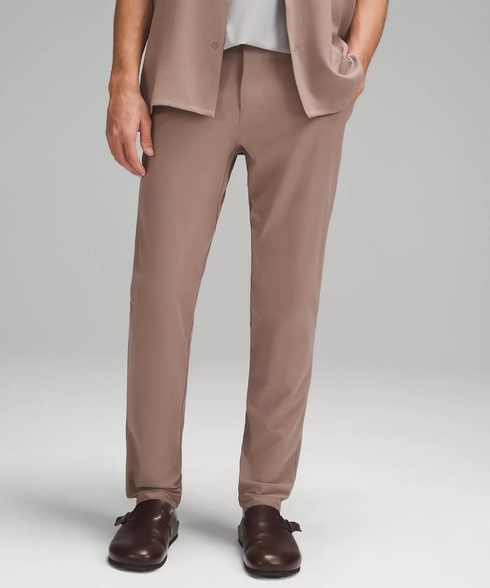 Waist-down image of a man wearing taupe Lululemon ABC Warpstreme Trouser 