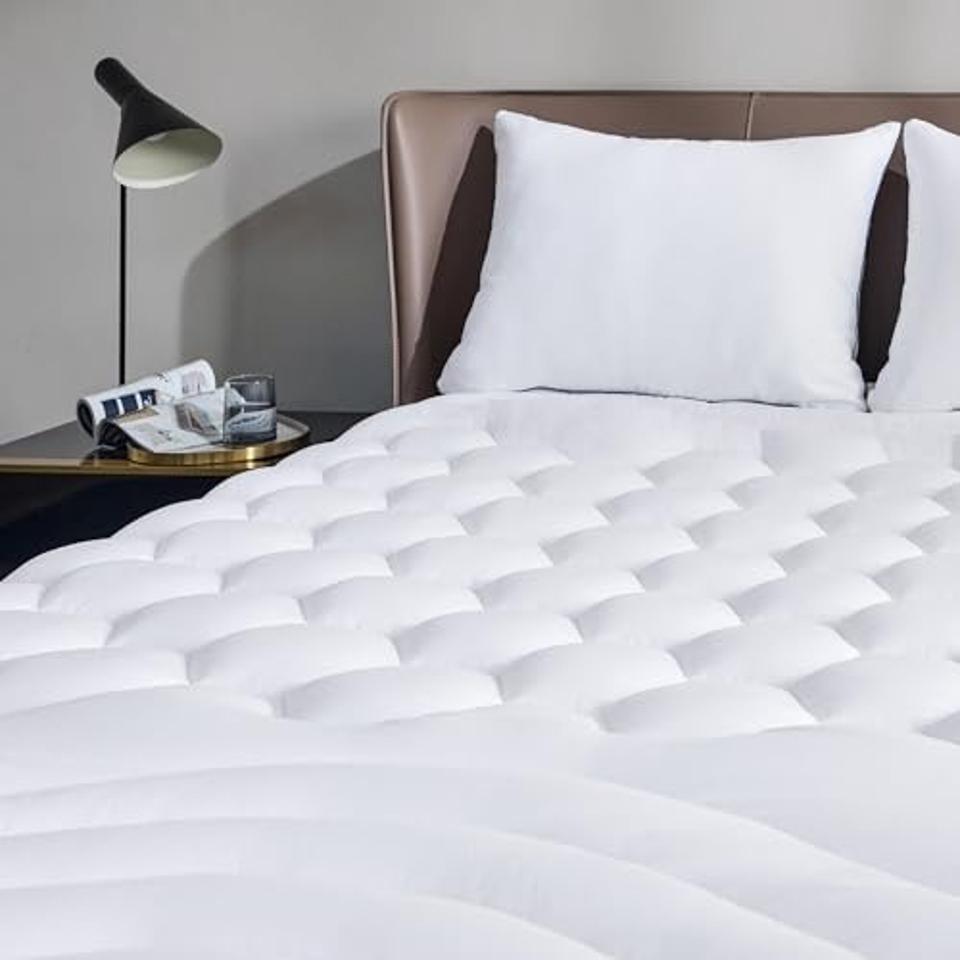 Bedsure Queen Size Mattress Pad on a bed