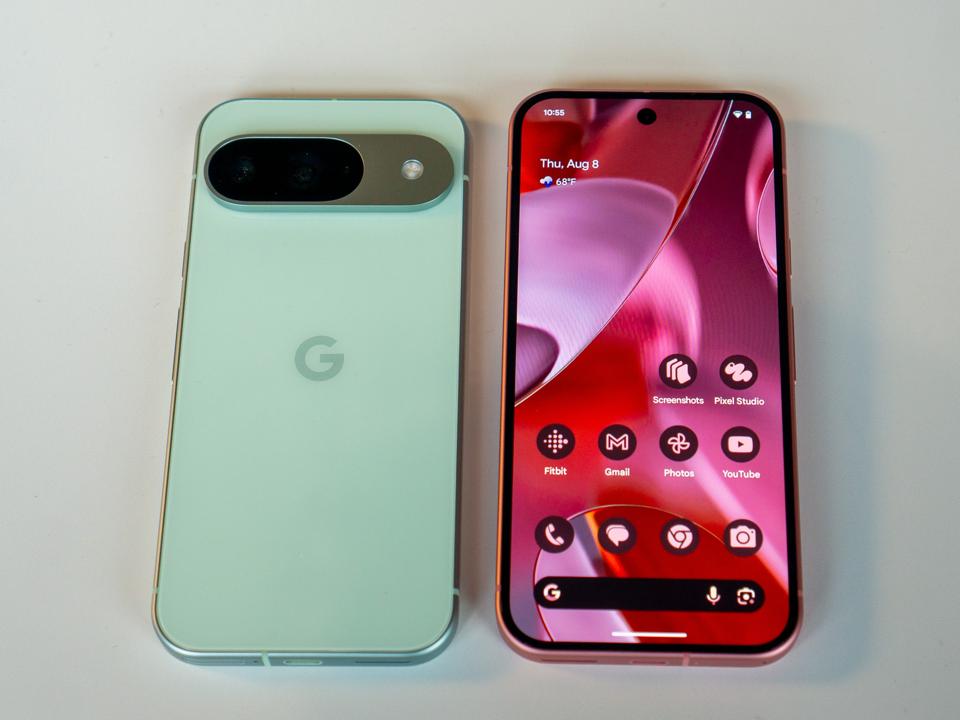 Two phones on a white tabletop.