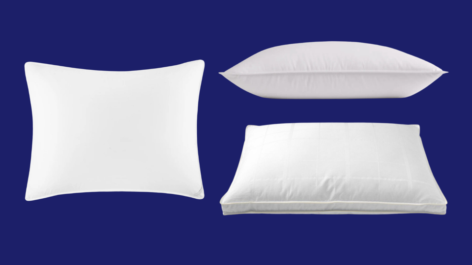 Three goose down pillows on a navy blue background