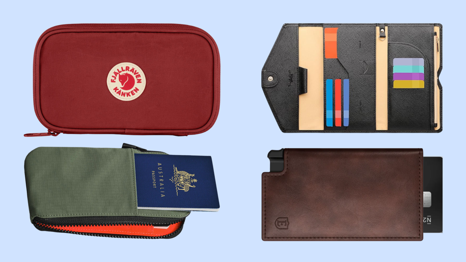 Four travel wallets against light blue background