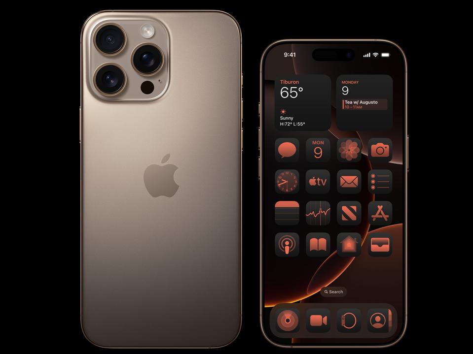 An iPhone 16 Pro and Pro Max in desert titanium on a black background