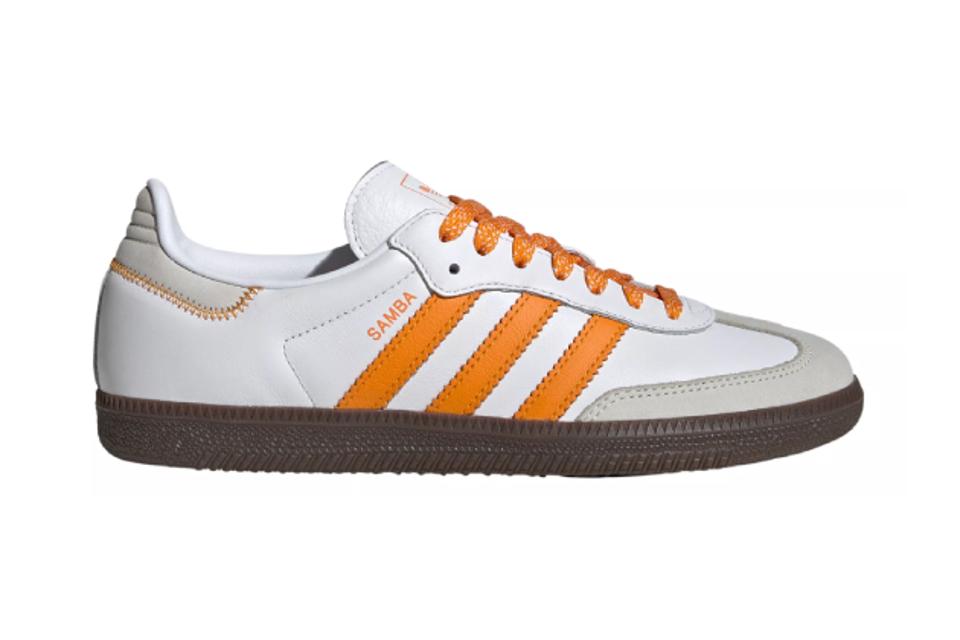 One orange and white Adidas Samba Og shoe.