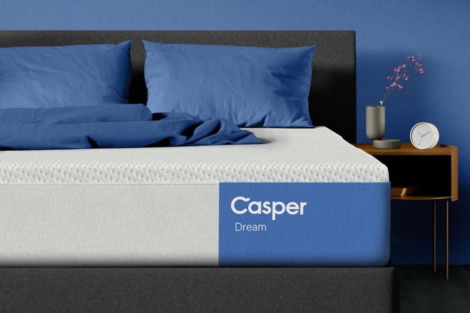 Casper Dream Mattress (Queen) in a blue room with a nightstand