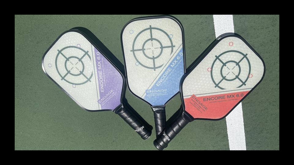 Three of the Engage Pickleball Encore EX 6.0 paddles on the ground.