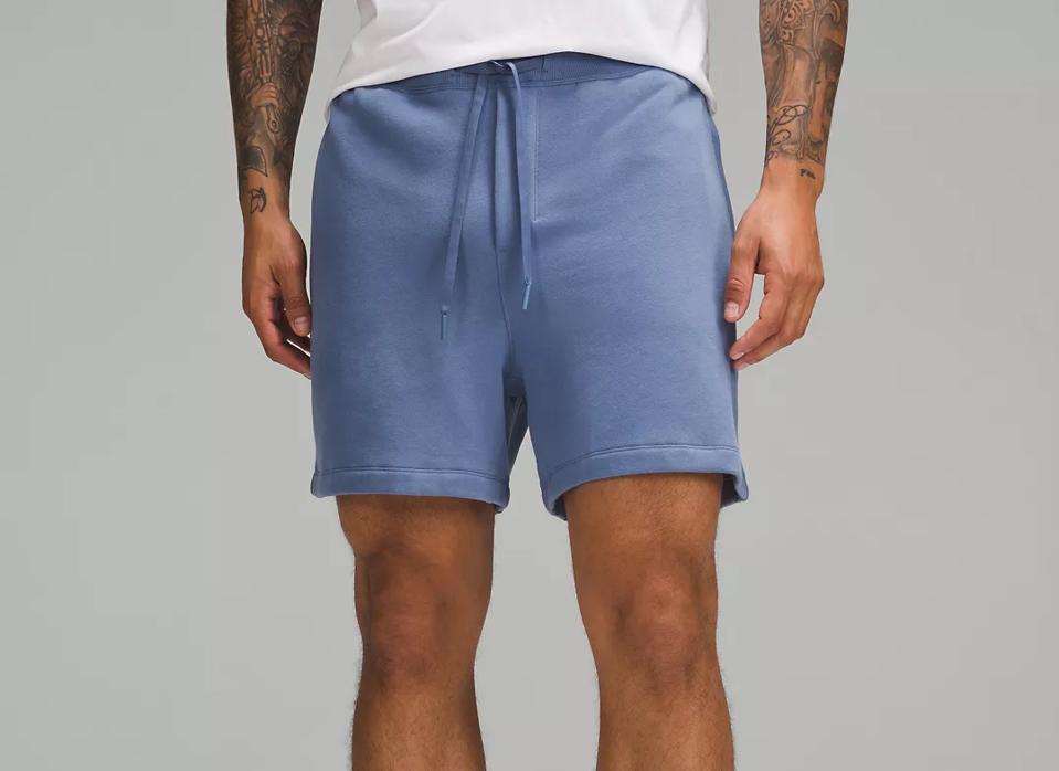 Waist-down shot of a man wearing Oasis Blue Lululemon Steady State Shorts.