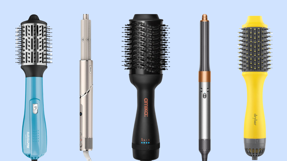 Five blow dryer brushes against light blue background