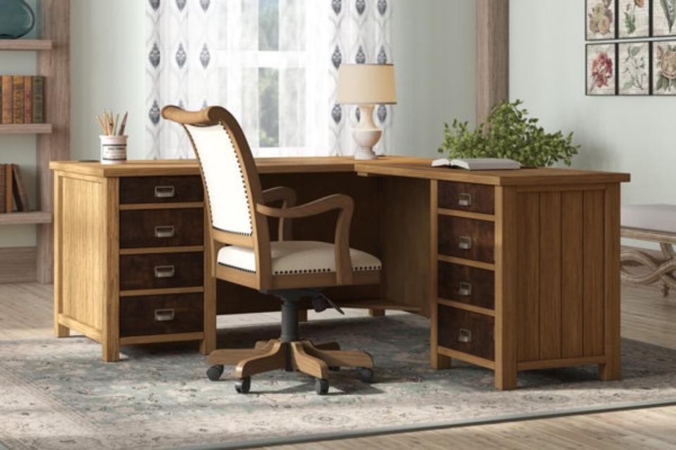 Barnett L-Shaped Solid Wood Top Executive Desk in a home office with a wooden upholstered office chair