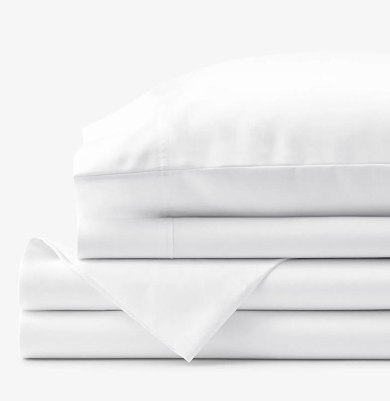 A stack of Company Store Legends sheets with a pillow on top