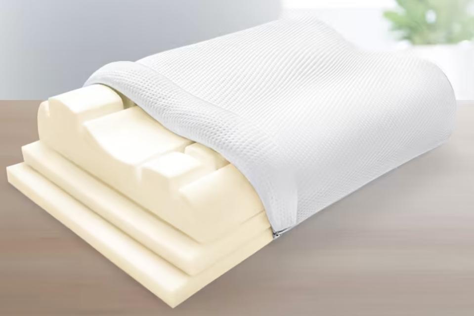 Sleep Number Ultimate True Temp Pillow exposing the three foam inserts inside on a table