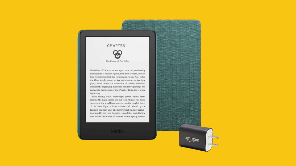 A Kindle with a green cover and charger against a bright yellow background.