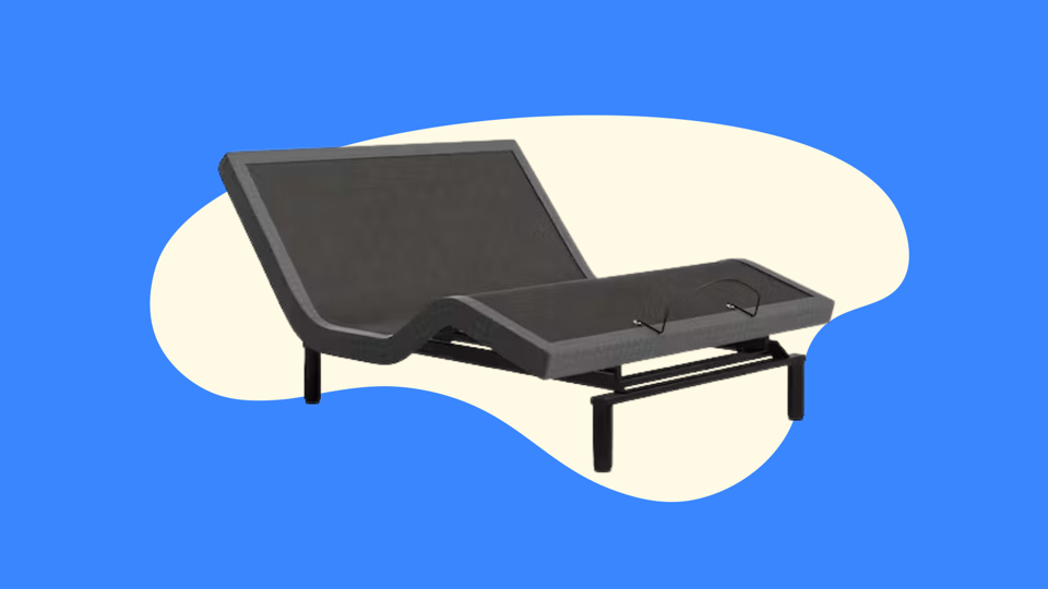 The Saatva Adjustable Bed Frame against a blue background. 