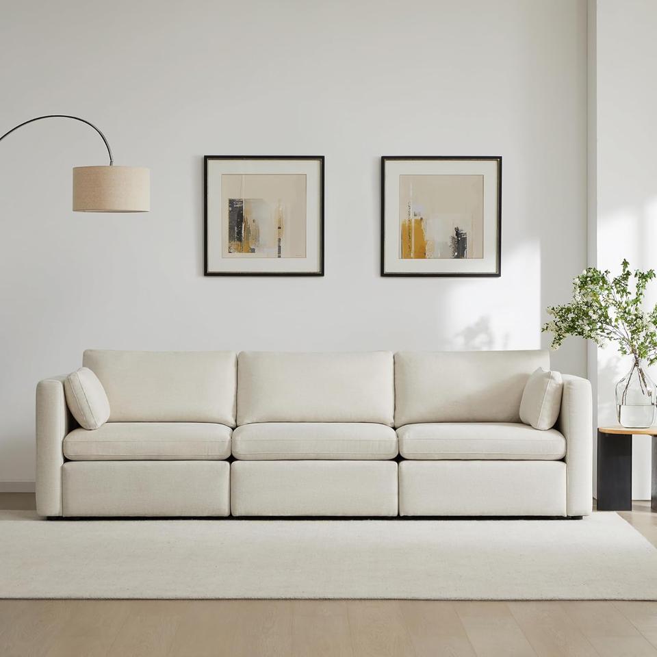 Chita Modular Sofa in a modern living room with rug.