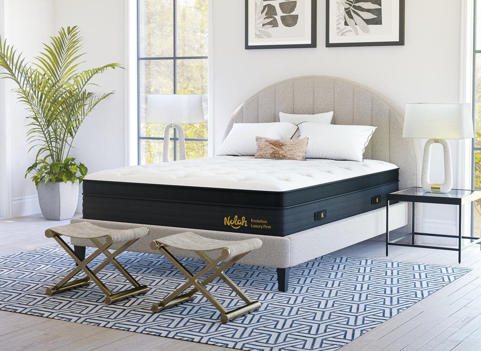 The Nolah Evolution 15 Inch Mattress on a bed frame in a decorated bedroom