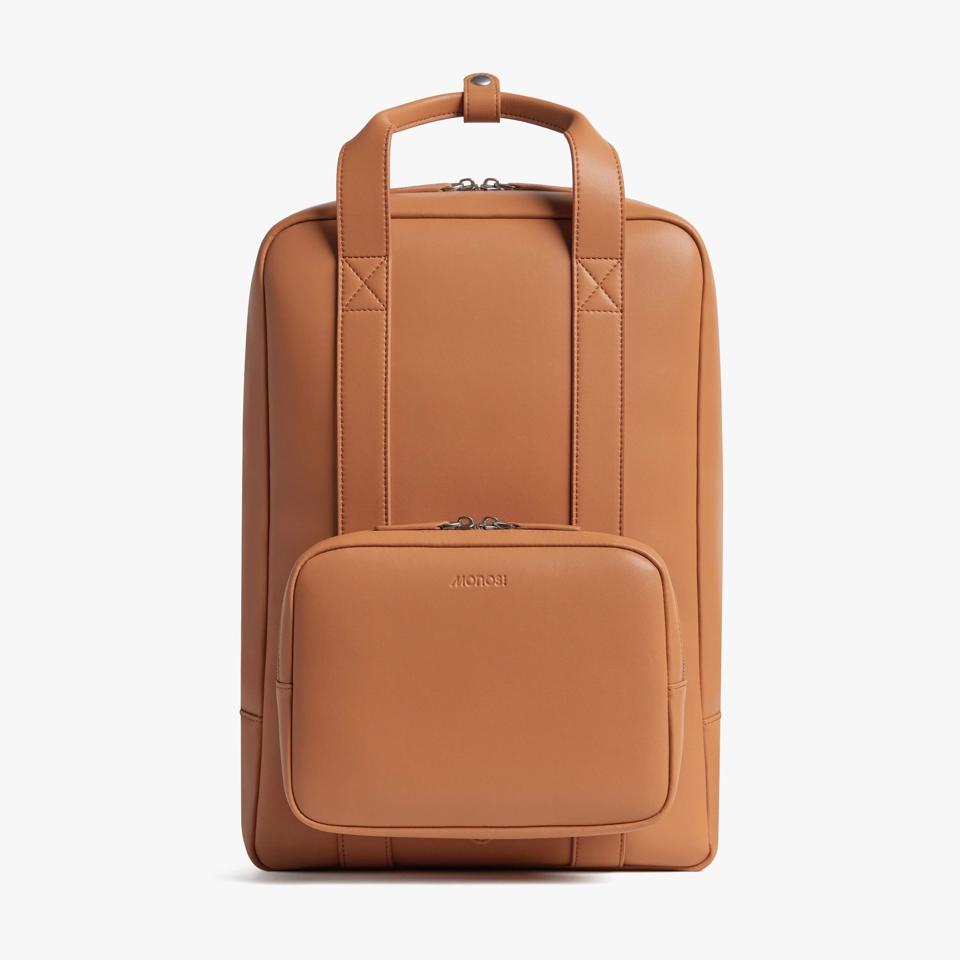 A brown backpack against a white background.