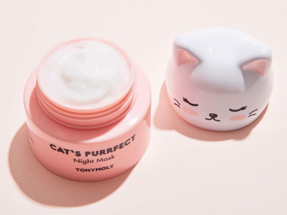 TonyMoly Cat's Purrfect Night Mask open with cat lid and container sitting on pink surface