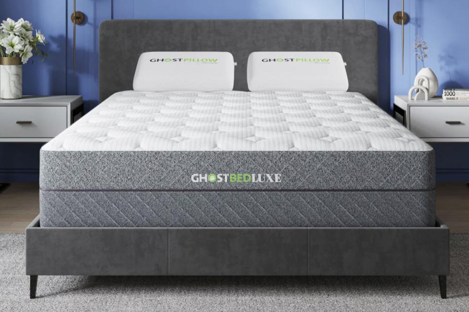 The GhostBed Luxe Mattress on top of a gray bed frame. 