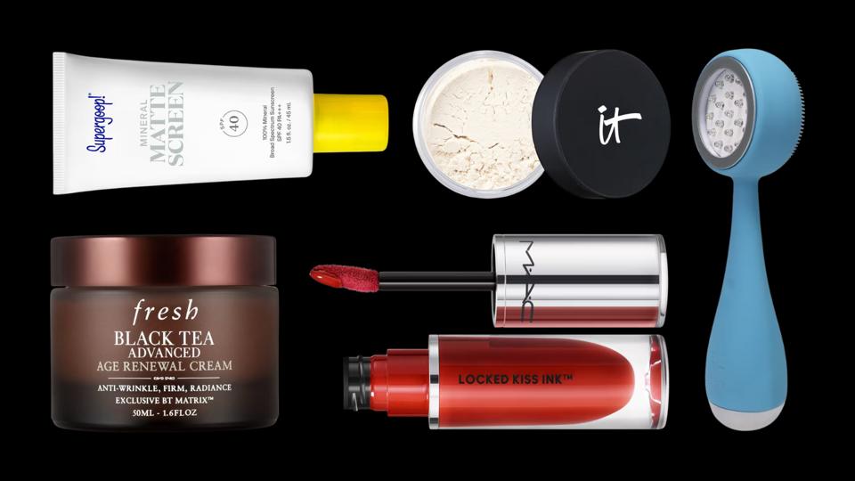 Black background featuring several beauty products from Supergoop, Fresh, IT, PMD and MAC.