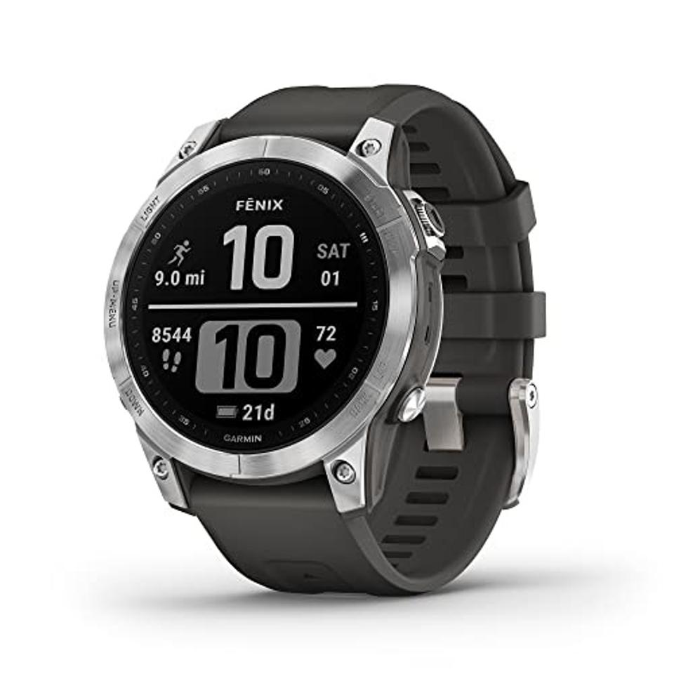 Garmin Fenix 7 in grey with a black wristband on a white background