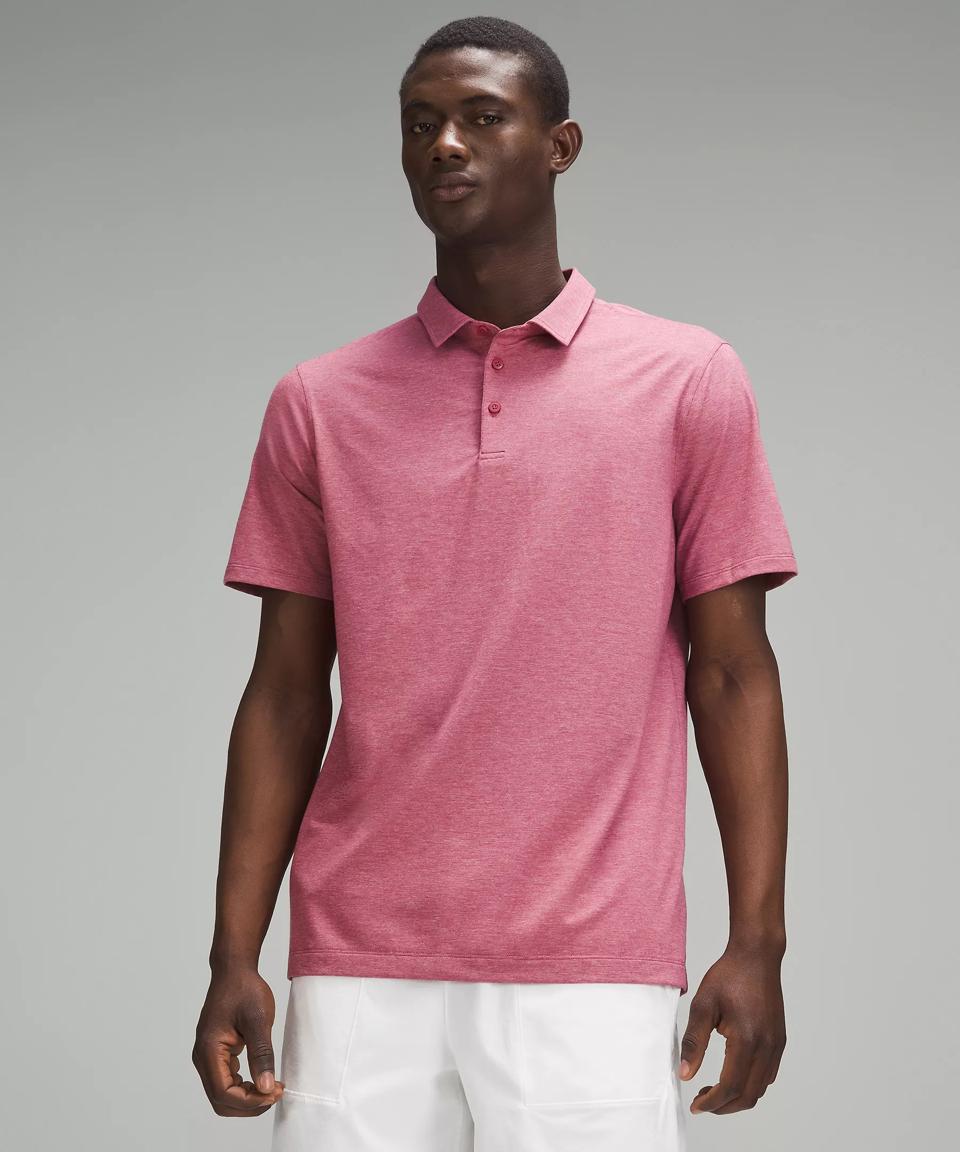 Man wearing a Red Lululemon Evolution Polo Shirt 