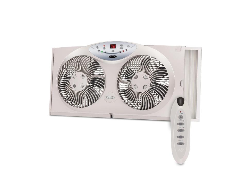 Bionaire Twin Reversible Airflow Window Fan w/ remote both beige on a white background.