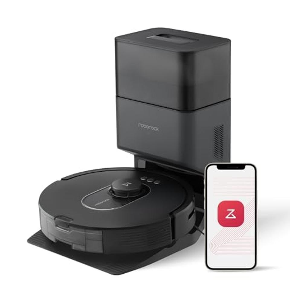 Product shot of Roborock Q5 Max+ Robot Vacuum With Self-Empty Dock next to a smartphone.