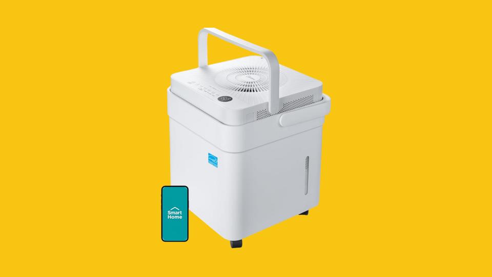 The Midea 50-Pint Cube dehumidifier against a yellow background