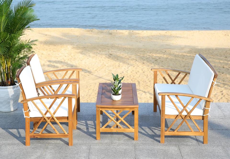 Lifestyle shot of Sand & Stable Calhoun 4-Person Outdoor Seating Group by the beach.