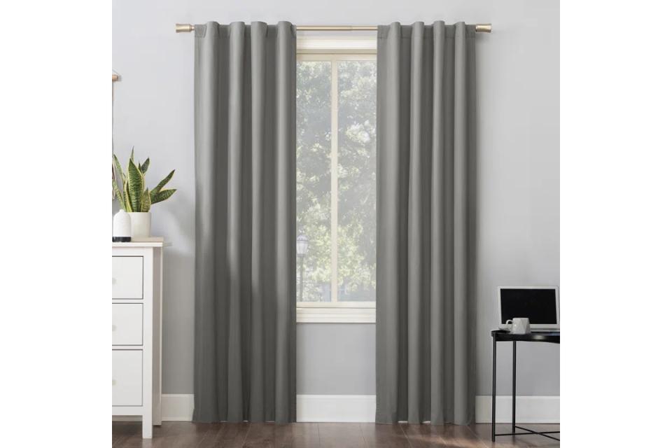 Wayfair Basics Solid Blackout Thermal Rod Curtain Panels in gray.