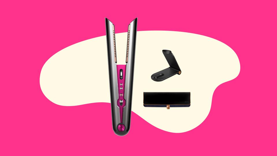 A gray and pink dyson corrale straightener on an abstract pink background 